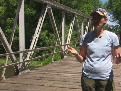 Image of a woman on a bridge.