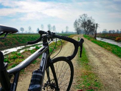 Bike standing on a gravel road.