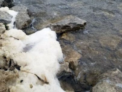 Foam on the bank of a lake.