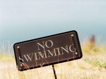 No swimming sign at a beach.