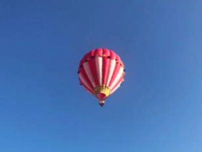 A hot air balloon floating through the air.