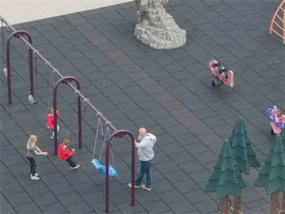 Children swinging on a playground.