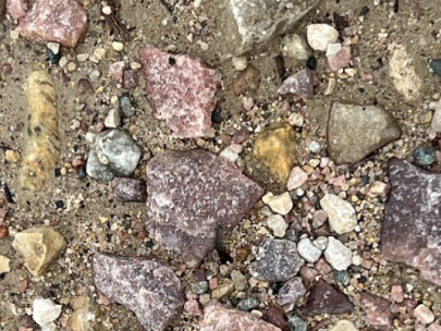 Variety of rocks including Punk Sioux Quartzite used on an Iowa Road